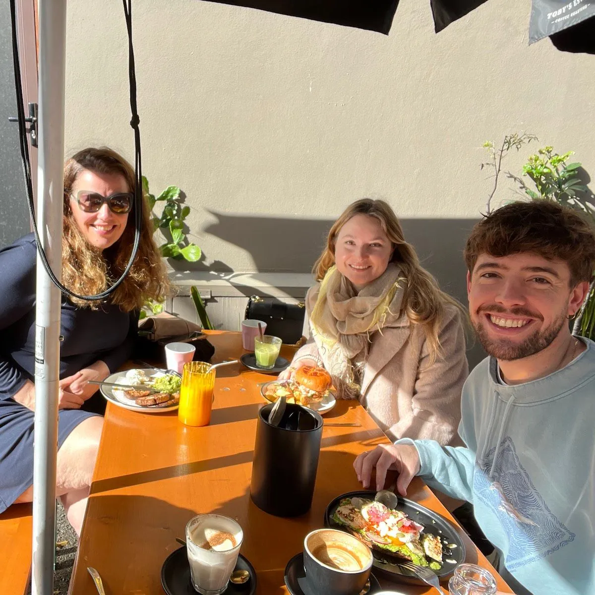 A small group of creatives meeting for lunch in their city