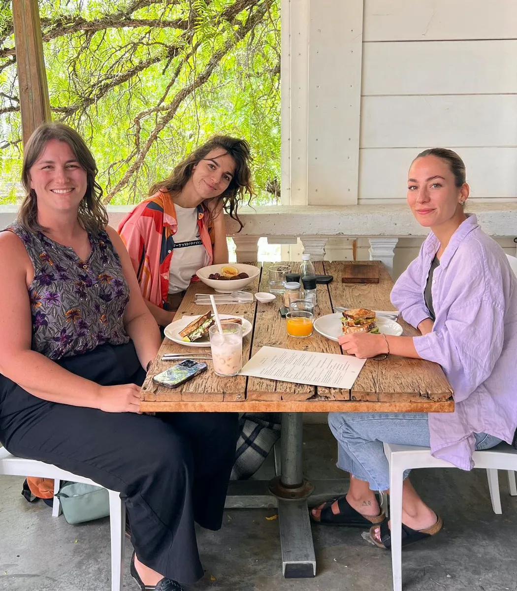 A small group of creatives meeting for lunch in their city