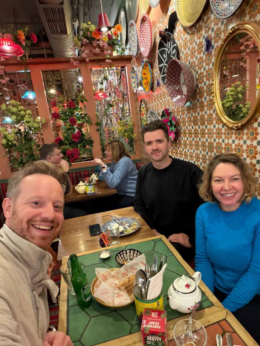 A small group of creatives meeting for lunch in their city