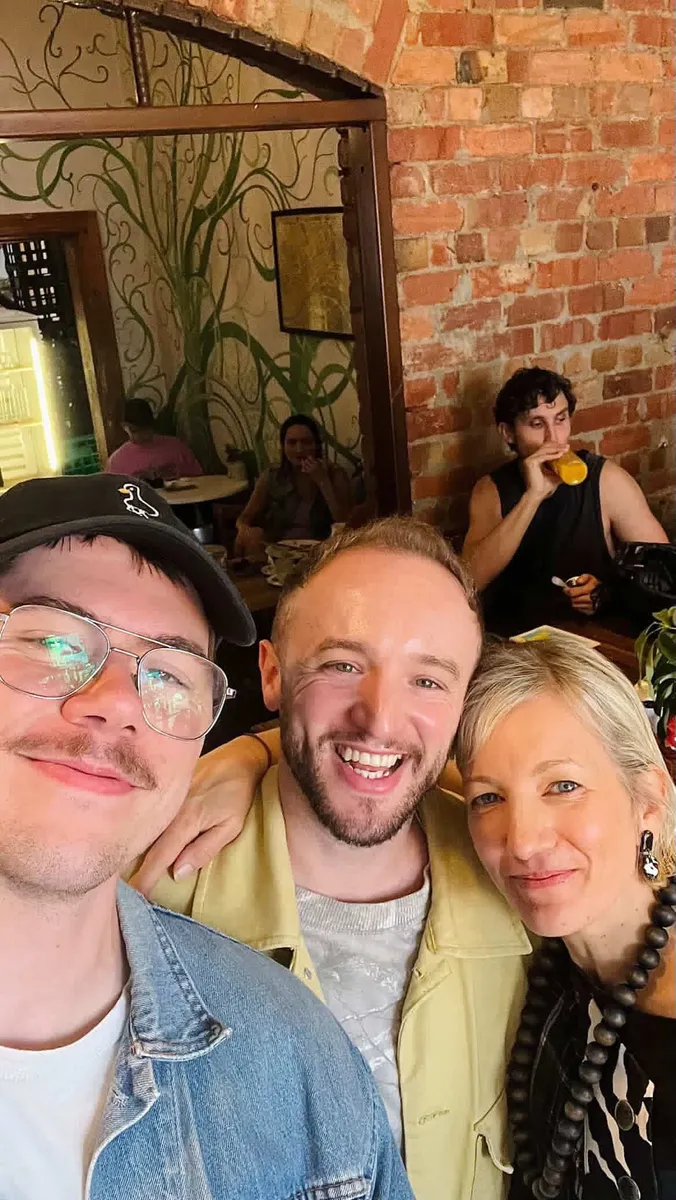 A small group of creatives meeting for lunch in their city