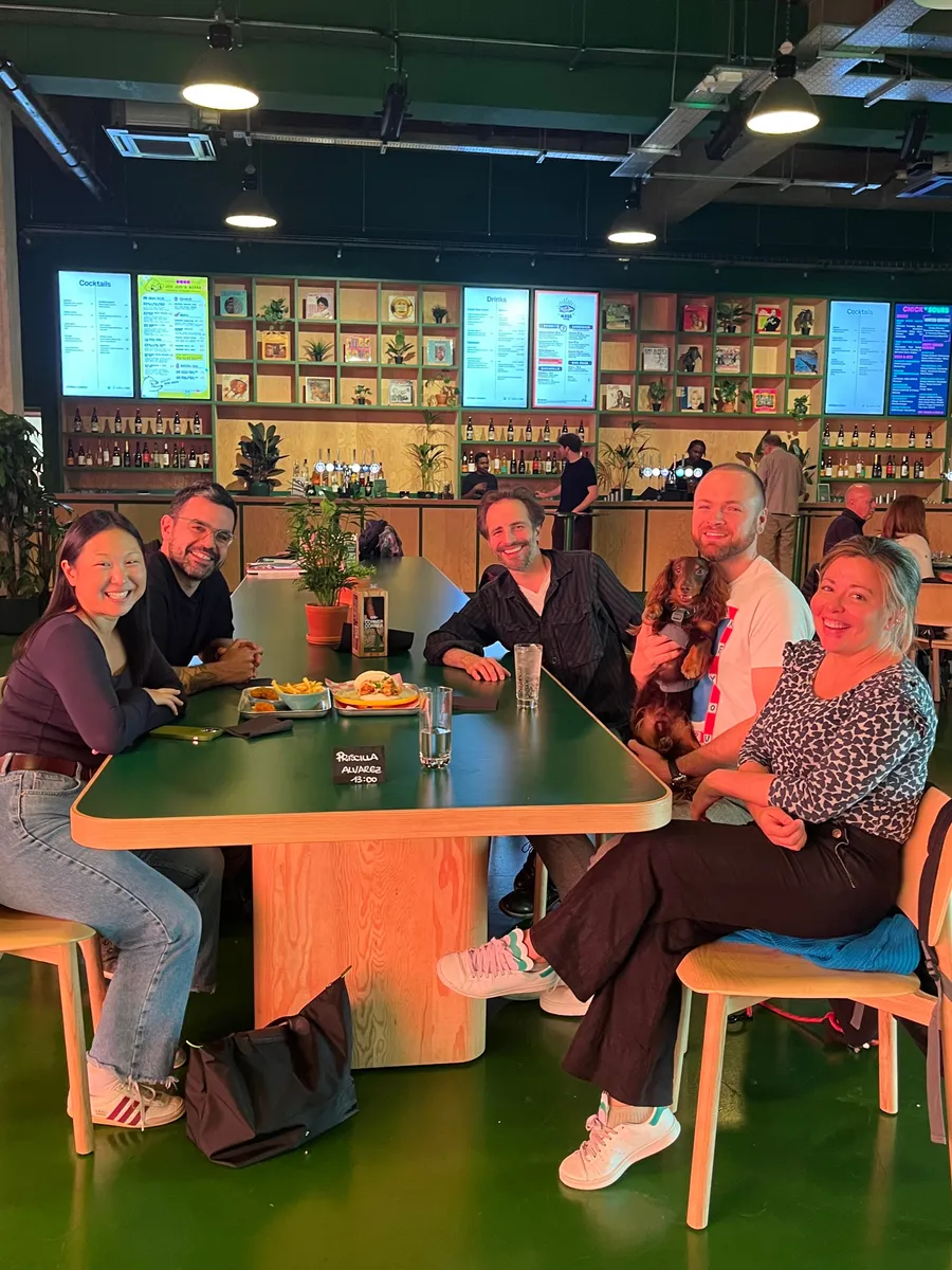 A small group of creatives meeting for lunch in their city