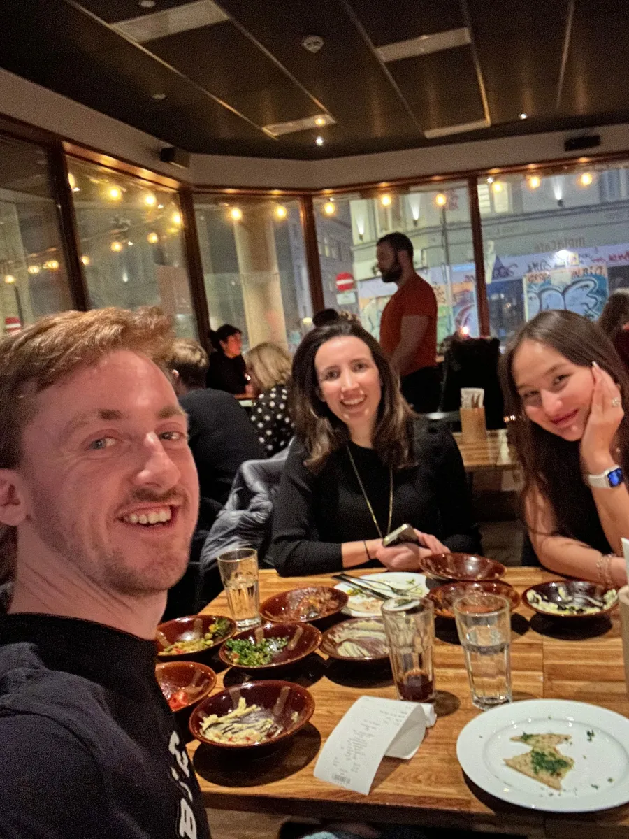 A group of creative professionals connecting over a relaxed lunch