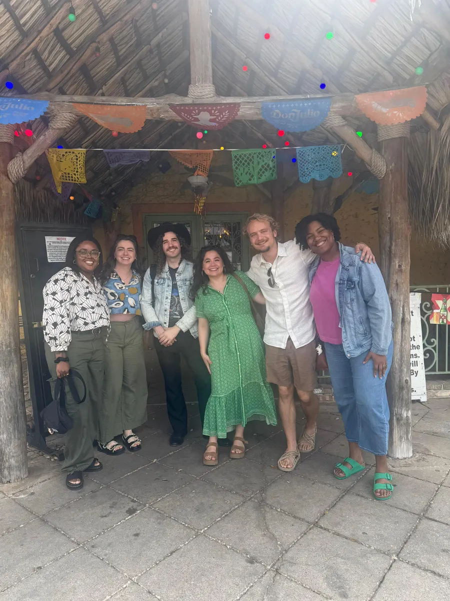 A small group of creatives meeting for lunch in their city